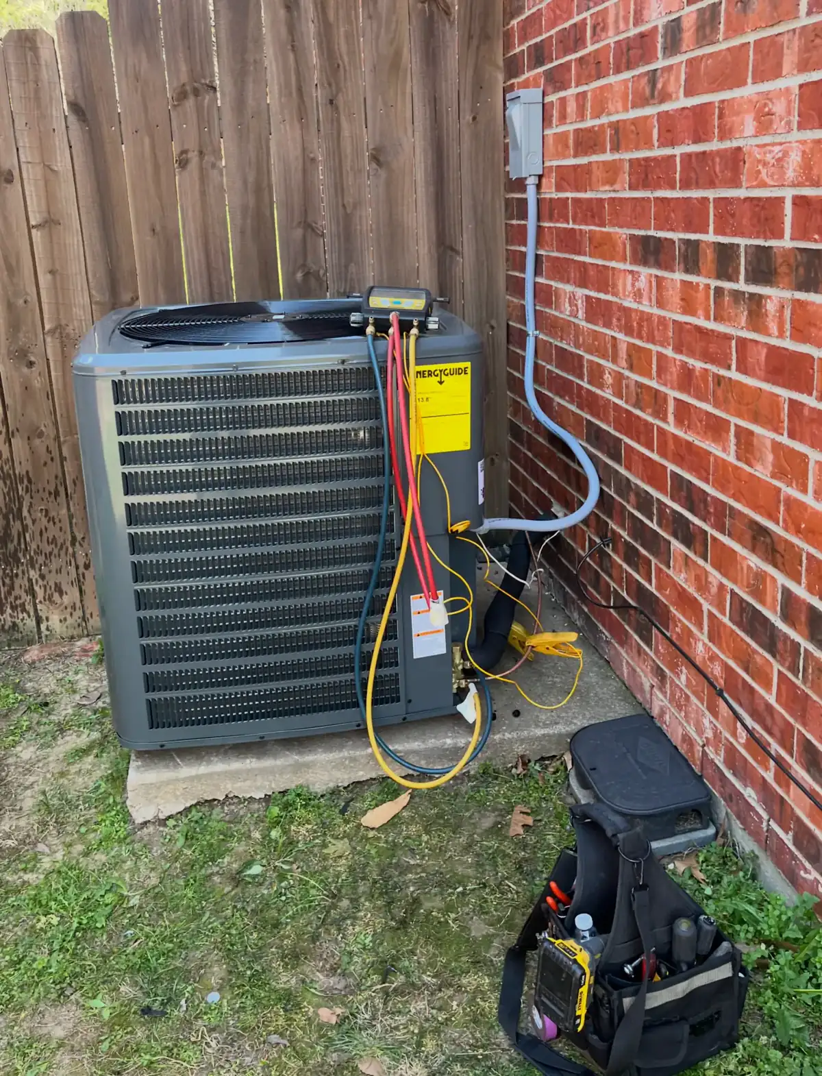 AC Refrigerant Diagnostic Service In Caddo Mills TX Technician performing refrigerant diagnostics on a residential air conditioner during an AC tune up in Caddo Mills TX